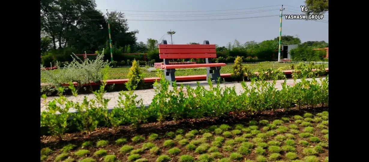 Landscaped garden and seating area at Yashaswi Group layout